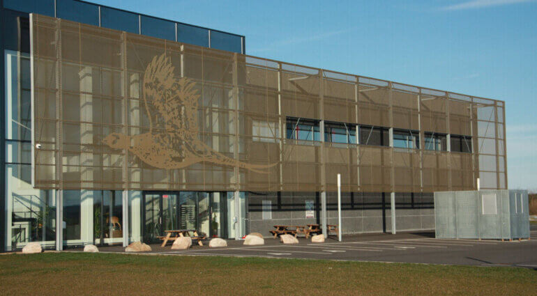 Perforated Image Design in Corten Steel Facade Cladding